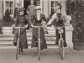 Three women on bicycles, early 1900s (b/w photo) 