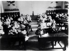 Children in a classroom (b/w photo) 