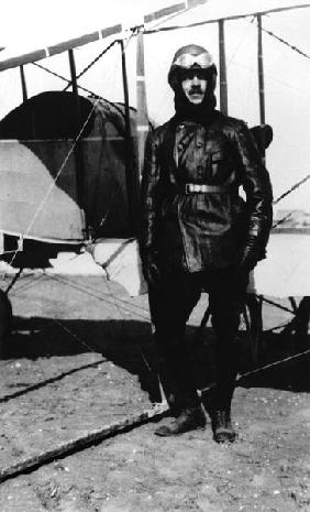 Roland Garros (1888-1918) standing beside his plane, 1915 (b/w photo) 