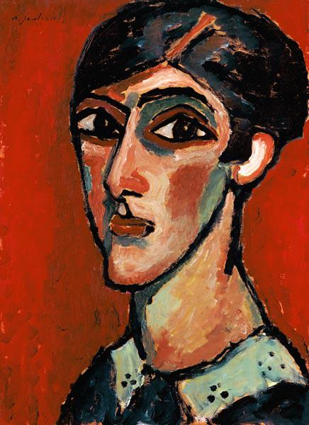 Länglicher Frauenkopf in Braunrot.