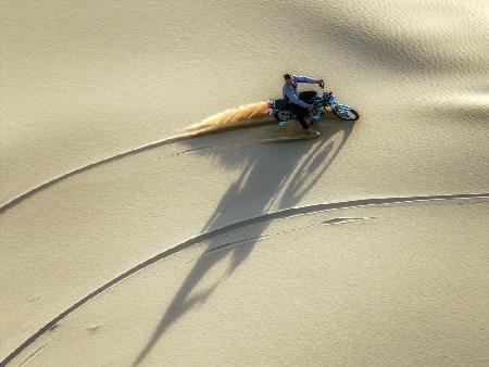 Moto rides in desert