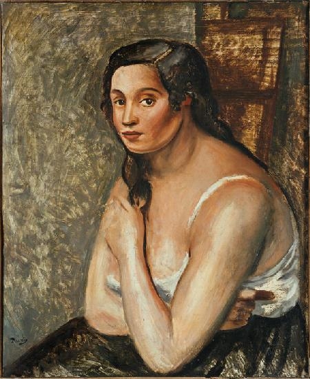 Seated woman in shirt.