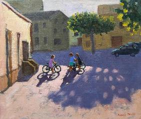 Three children with bicycles, Spain