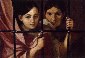Zwei Frauen hinter einem Gitter