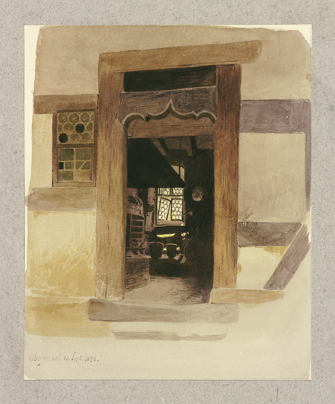 Blick durch einen geschnitzten Türrahmen in einen Innenraum in Oberwesel von Carl Theodor Reiffenstein