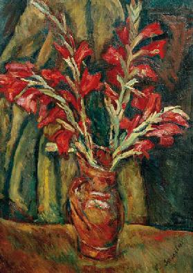 Rote Gladiolen in einer Vase