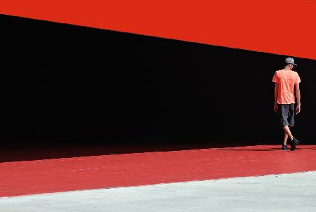 a man between geometries of light and colors