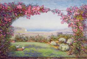 Ein Garten mit einem Rosenbogen