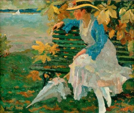 Lady on a park bench by the lake