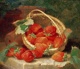 A Basket of Strawberries on a stone ledge