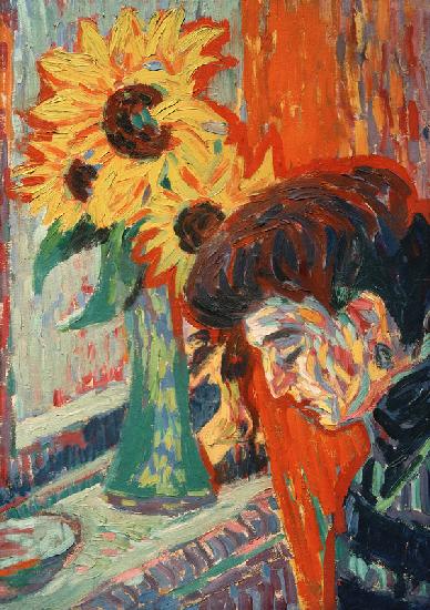 Frauenkopf vor Sonnenblumen