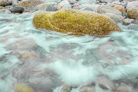 Relaxation between movement and stillness. Sea and rocks