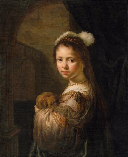 Mädchen mit kleinem Hund im Arm.