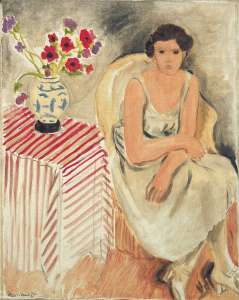 Woman on a chair - Flowers on the table, or carnations