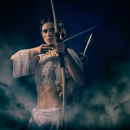 Greek goddess with bow and arrow.