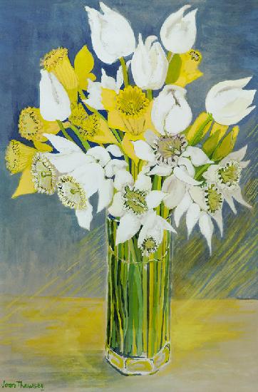 Daffodils and white tulips in an octagonal glass vase