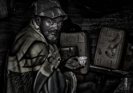 Ethiopian man having a cup of coffee.