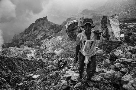 Sulfur worker in volcano Kawah Ijen (Indonesia)