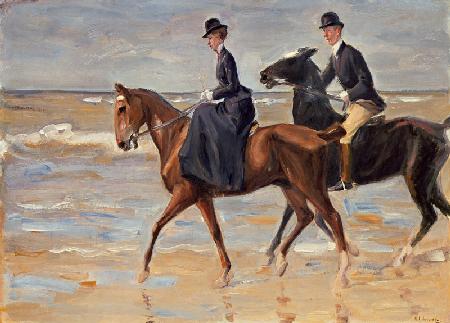 Reiter und Reiterin am Strand