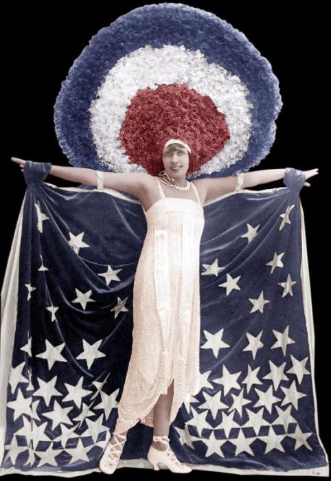 Mistinguett wearing giant headgear in her show in Paris von 