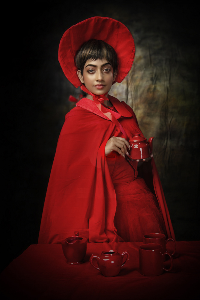 THE GIRL WITH RED TEA SET von PARTHA BHATTACHARYYA