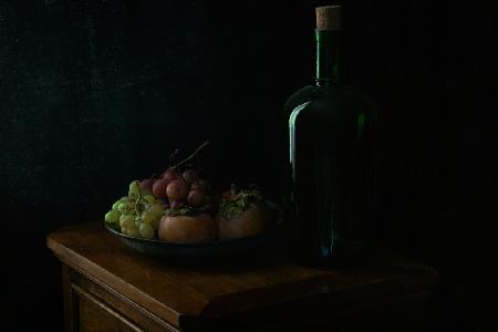 Green bottle and fruits