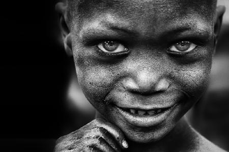 Kids smile, miners hands - Benin