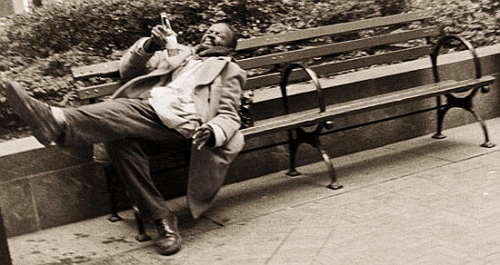 Drunk man on a park bench von Stephen  Spiller