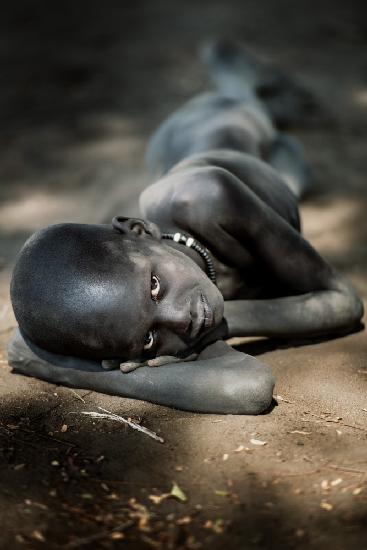 Young Mundari boy at rest