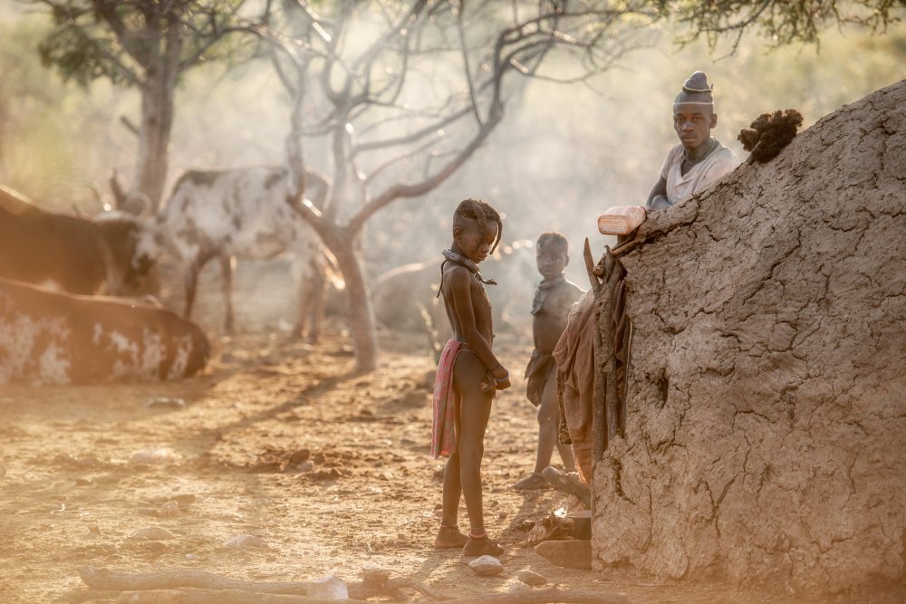Dawn in a Himba village von Trevor Cole