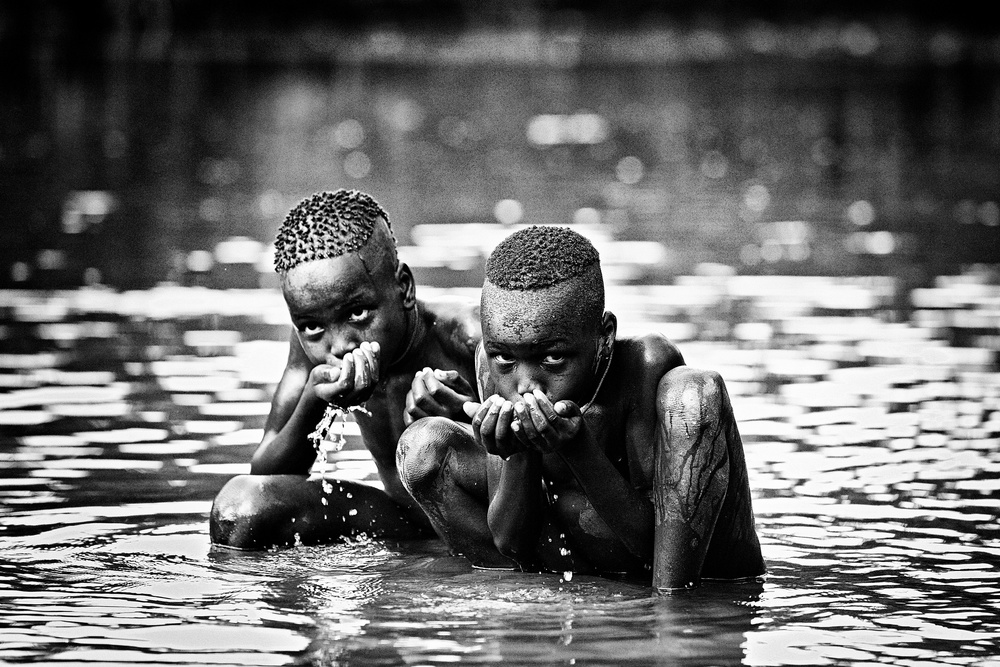 Children in the river von Vedran Vidak