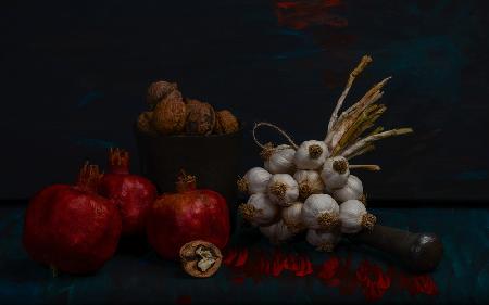 Still life with garlic, walnuts and pomegranates
